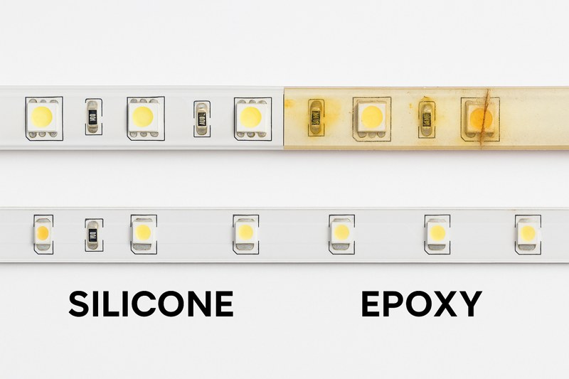 A side-by-side comparison photo. On the left is a pristine, clear silicone-extruded LED strip. On the right is a yellowed, cracked, and failing epoxy-coated strip of the same age.