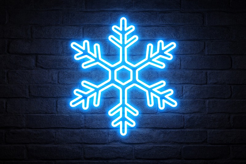 A custom-made LED Neon sign in the shape of a snowflake, glowing bright blue with no visible dots.