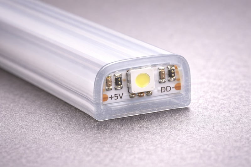 Photo: A cross section of IP68 Solid Extrusion. The LED chip is completely buried inside the clear material. No air gaps.