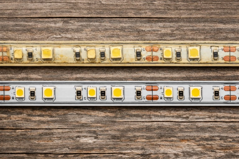 UV damaged yellow LED strip next to clear silicone strip
