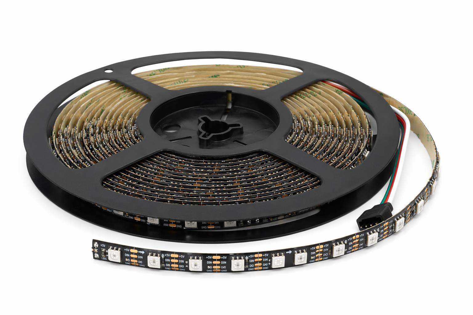 Addressable SMD LED strip light on reel spool with visible individual addressable RGB LED chips and connector cable