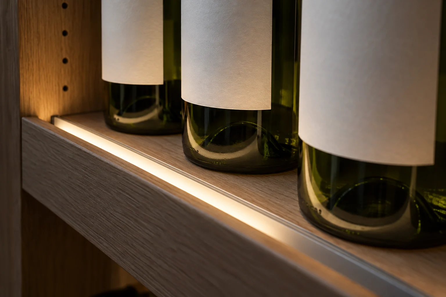 Concept detail of a diffused linear profile beside the front edge of a wine shelf